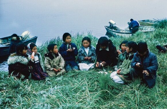 Children eating beluga flipper